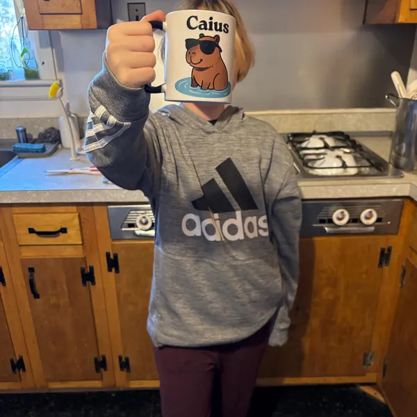 Customer photo of a personalised capybara mug from TheMugVault